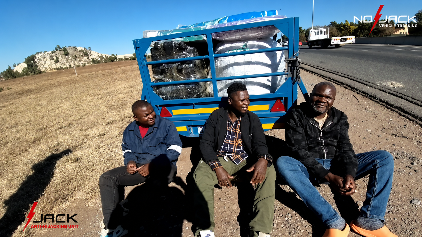 The recovered trailer and its load on the N12 shoulder, with the occupants detained on scene
