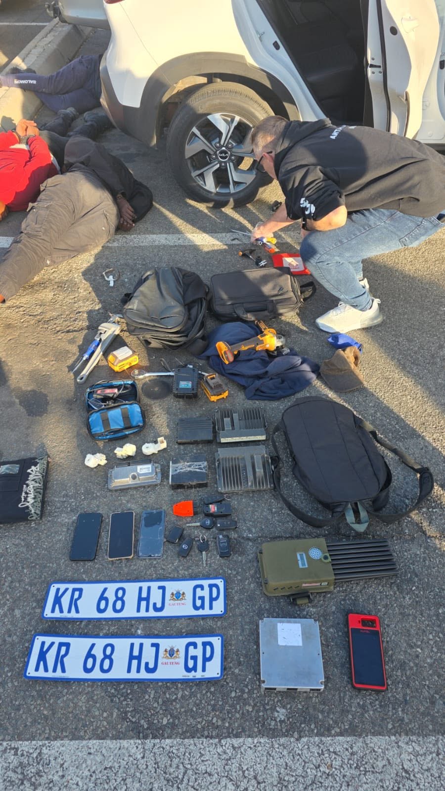 Signal jammers and break-in equipment recovered during the operation.